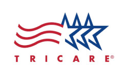 Professional team of six standing in front of Horvath Vision Care sign.