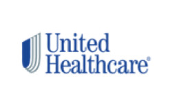 Professional team of six standing in front of Horvath Vision Care sign.